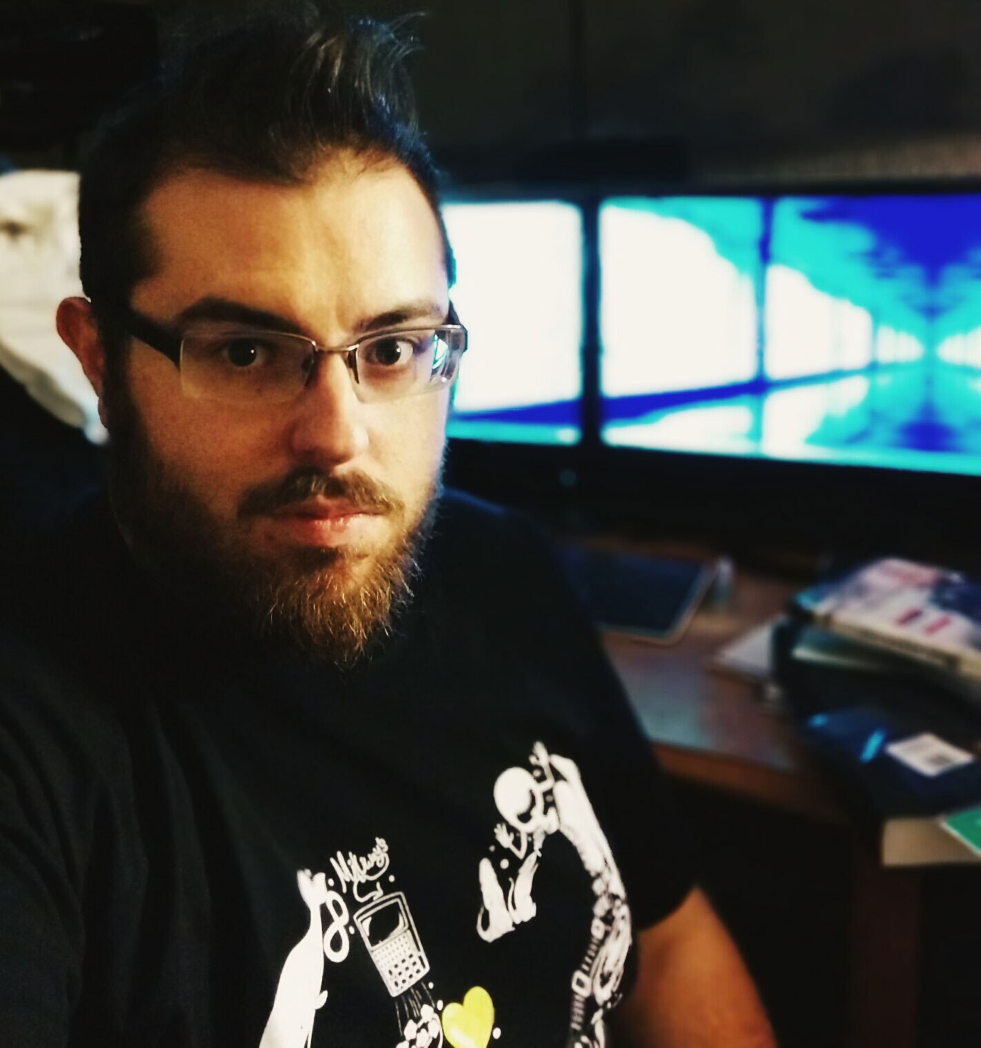 Photo os Steven Kielbasa in front of his desk