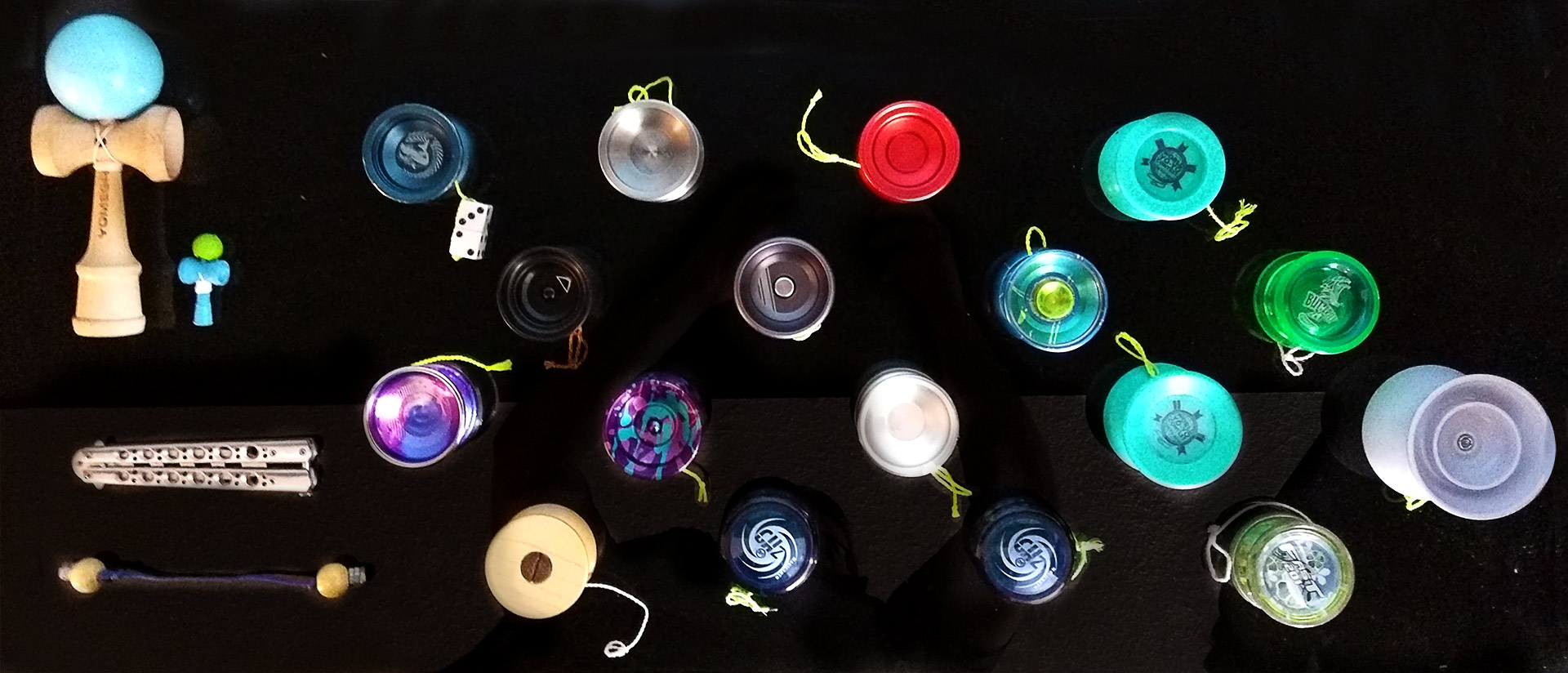 A series of yoyos and other skill toys arranged in a grid